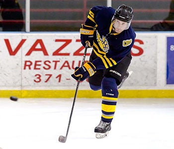 Jeffrey Goddu playing hockey.