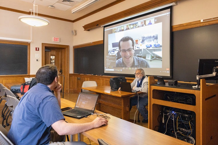 Yale Employees testing the technology in a classroom.