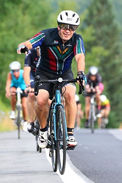 Michael during the 112-mile cycling portion of the July 2022 Ironman Lake Placid; Photo courtesy of Michael van Emmenes