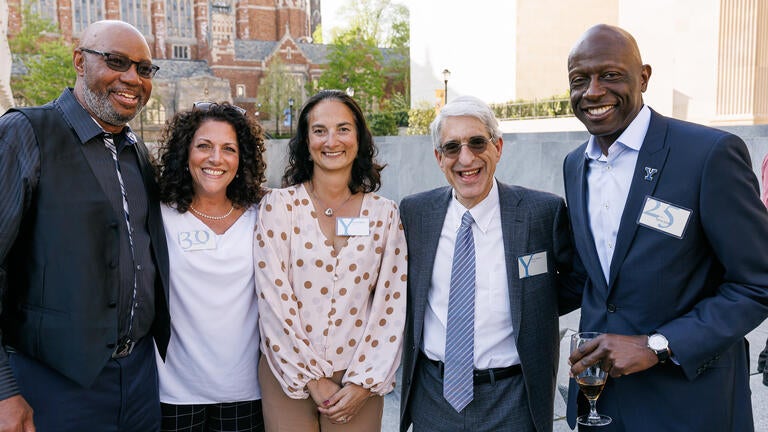 Pictured from left to right: Joseph Hamilton, Sandra Vitale (30-year honoree), Susan Gibbions, President Salovey, and James Jones (25-year honoree).