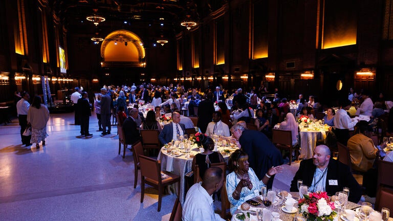 Everyone begins to take their seats in the beautifully-decorated Commons Dining Hall at the Schwarzman Center.