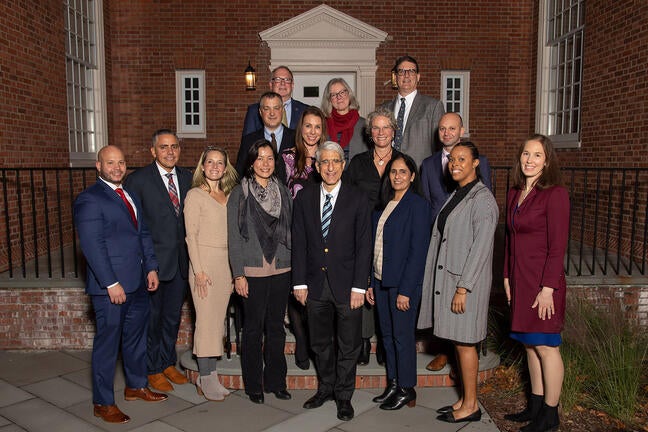 At Yale Health, the School of Public Health, Yale College, Yale Hospitality, Information Technology Services, Facilities, and the Office of Public Safety’s: Stephen Woods, Madeline Wilson, Ted Hanss (top row); J. P. Fernandes, Lisa Kimmel, Alexa Martindale, Adam Millman (middle row); Christian Berrios, Samuel Feliciano, Sarah Christie, Christine Chen, Hema Bakthavatchalam, Lauren Horner, Kathleen Omollo (bottom row) and with President Salovey (not shown in photo: Margaret Anderson, Karen Otterson, Dorothy v