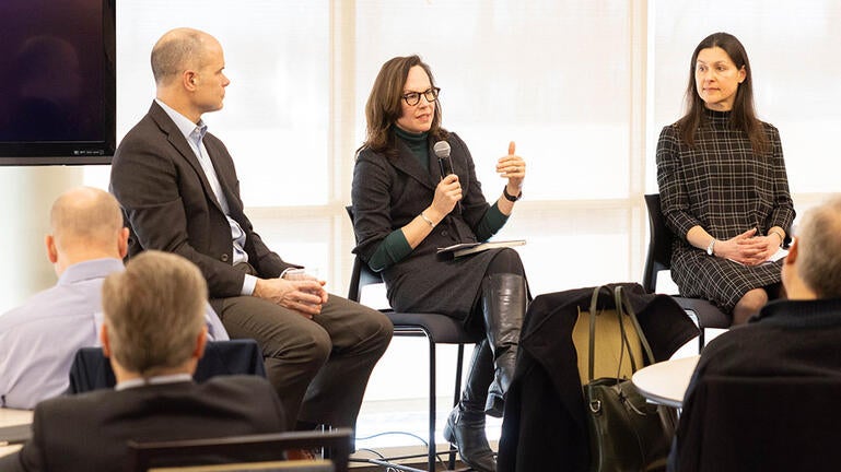 John Barden, Barbara Rockenbach, and Jenny Frederick participate in a panel discussion in front of IT Leaders at a Strategy Meeting at West Campus