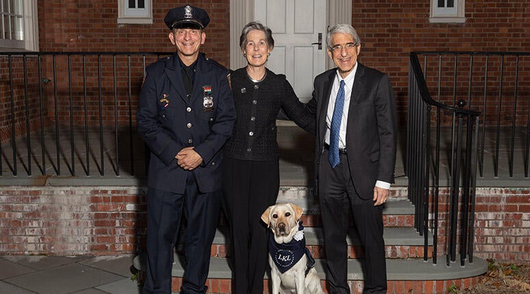 Public Safety's Richard Simons and Heidi, Yale's Public Safety Service Dog, with President Salovey and Linda Lorimer.