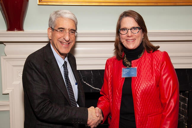 Photo of Kathleen Uscinski from the Yale Cancer Center with President Salovey