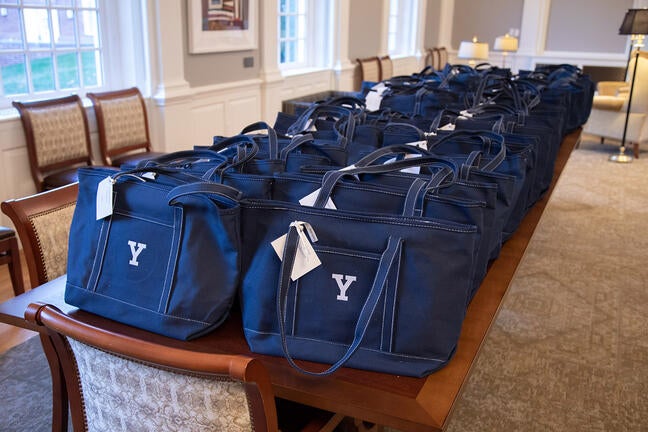 Yale bags, each containing an etched crystal award and a display portfolio with a letter from President Salovey, lay in wait for this year’s celebrants.