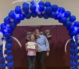 Bill Buccheri, Internal Communications, poses with daughter Allison at her graduation from elementary school.