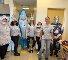 IT staff dressed up for a Halloween party.