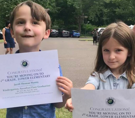 Adam Manny, Information Technology, took this photo of Cassidy and Jacob Manny graduating from kindergarten at Elm City Montessori.