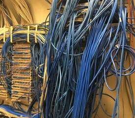 Example of network closet pre-remediation.