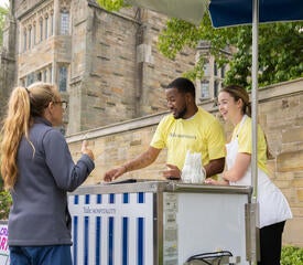 Yale Hospitality staff handing out frozen ice.