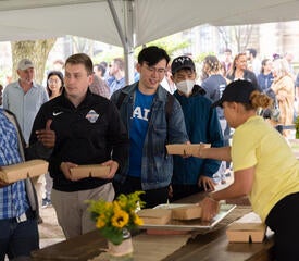 Yale Hospitality staff handing out lunches.