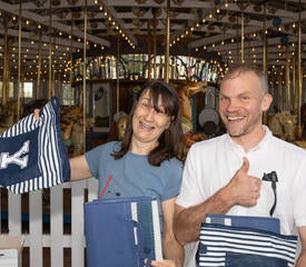 Photo of staff at the IT Community Picnic with Yale bags.