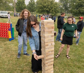 Photo of staff at the IT Community Picnic playing yard games.