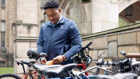 Tamaris McClain, facilities superintendent in the Yale Office of Facilities, tags a bike.