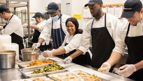 Yale Hospitality staff prepare food for Thanksgiving dinner.
